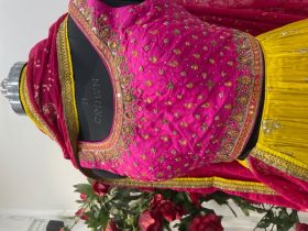 BRIGHT YELLOW LEHNGA WITH HOT PINK EMBROIDERED SILK BLOUSE AND NET DUPATTA