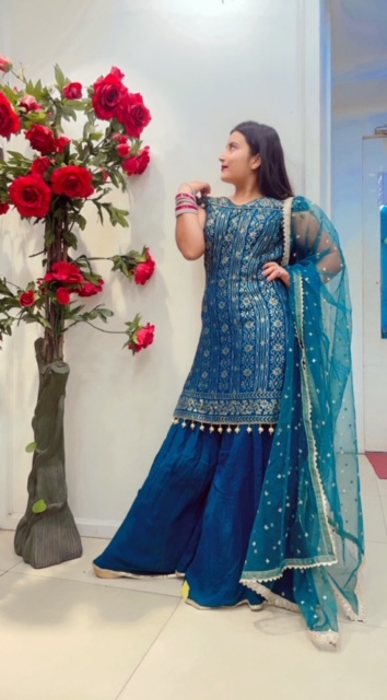 OFF-SHOULDER FERN GREEN GEORGETTE SHARARA SUIT WITH SEQUIN WORKED AND NET DUPATTA